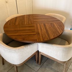 Brown table with beige chairs