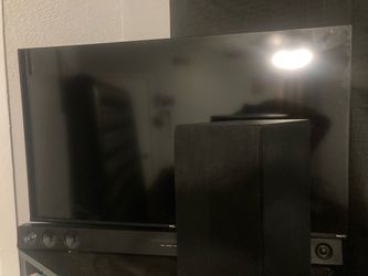 TCL Roku TV Flat Screen Television with a sound system