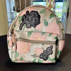 The COACH Camo Rose Mini Charlie Backpack Khaki/Blush