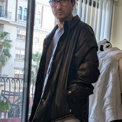 black faux leather overshirt jacket from Standard Cloth by Urban Outfitters.