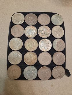 Assorted Dates Peace Silver Dollars.  $55 each