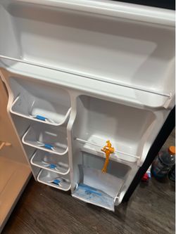 Black mini fridge in the box