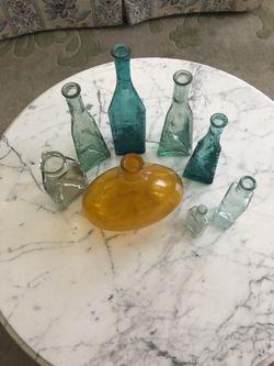 Colored glass bottles . Buy all for $25.