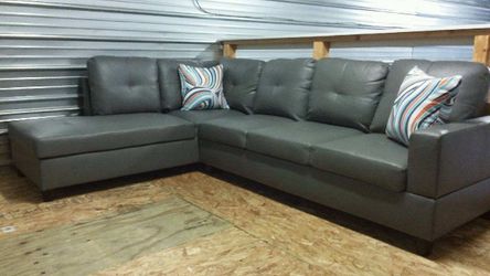 Brand New Grey Leather Sectional With 2 Decorative Pillows