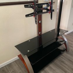 Tv Stand And Mount. Looks like new with no scratches 