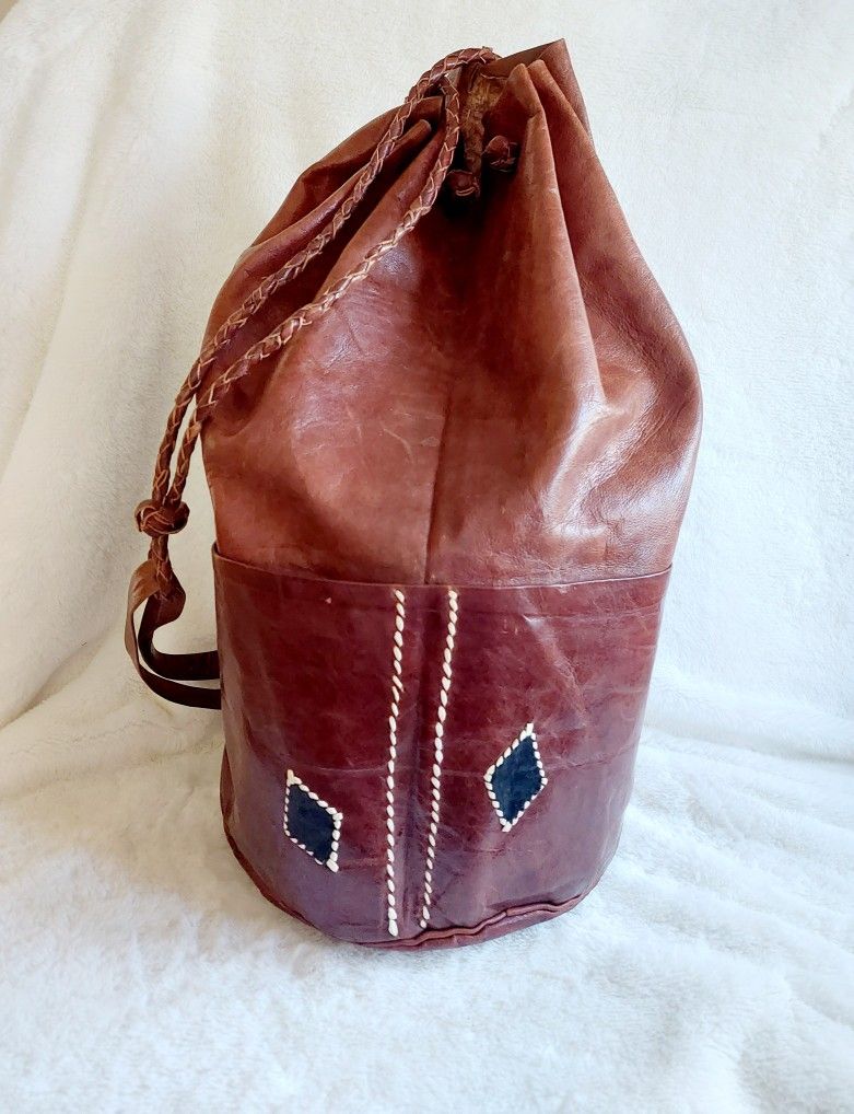 16" Soft Genuine Leather Backpack Satchel Shoulder Tote Hippy Hobo Hand Bag with Rope Straps and 4 Exterior Pockets. Pre-owned in excellent condition.