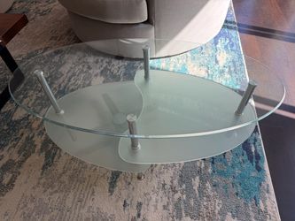 Modern two-level glass coffee table with metal legs