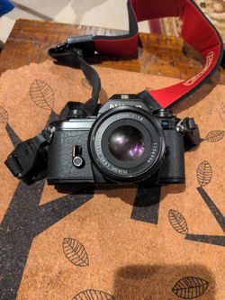 nikon em