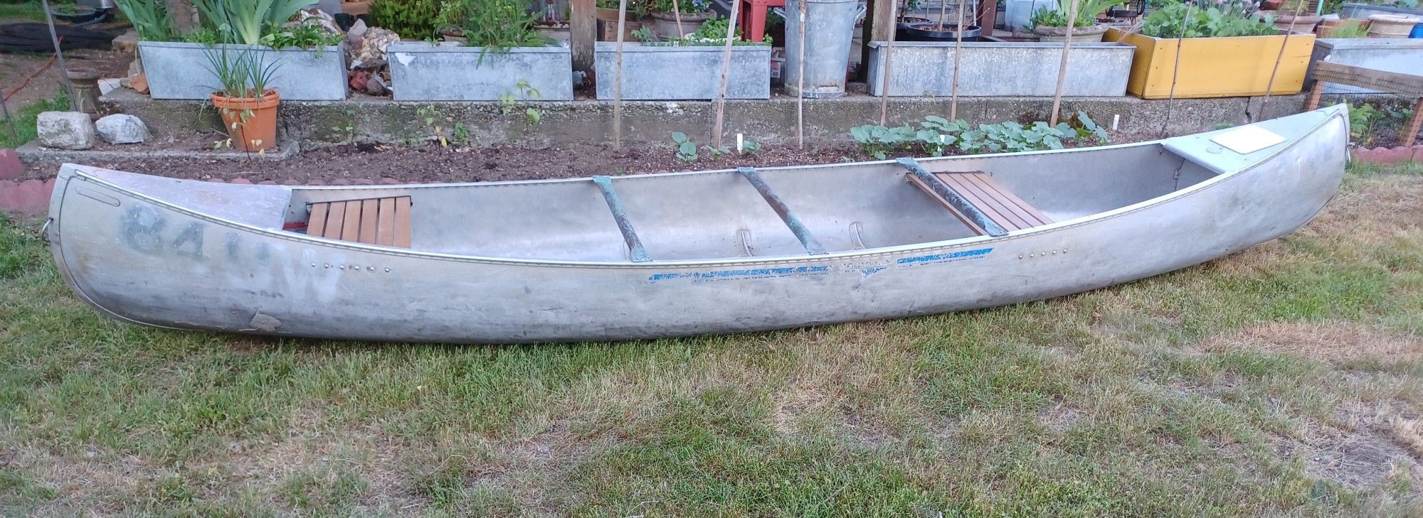 2 Grumman Aluminum Canoes and an Eddyline WR520 Tandem Kayak for Sale
