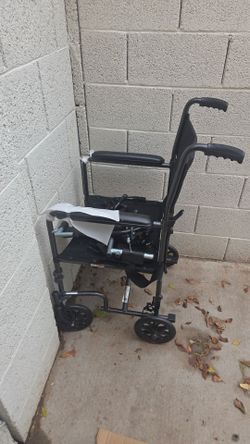 Transport wheelchair 18 in with leg support..
