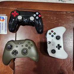 Two Xbox One Controllers In Perfect Condition And One PS4
