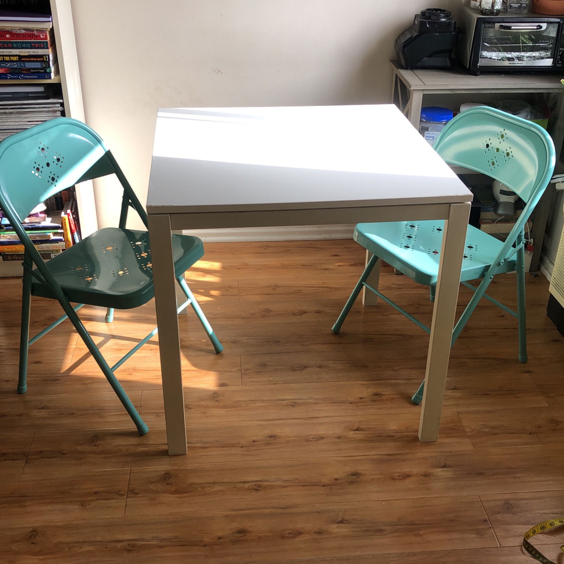 White Table & Teal Chairs
