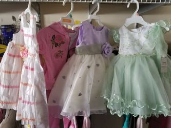 Baby girl brand new dresses...size 12 and 18 months