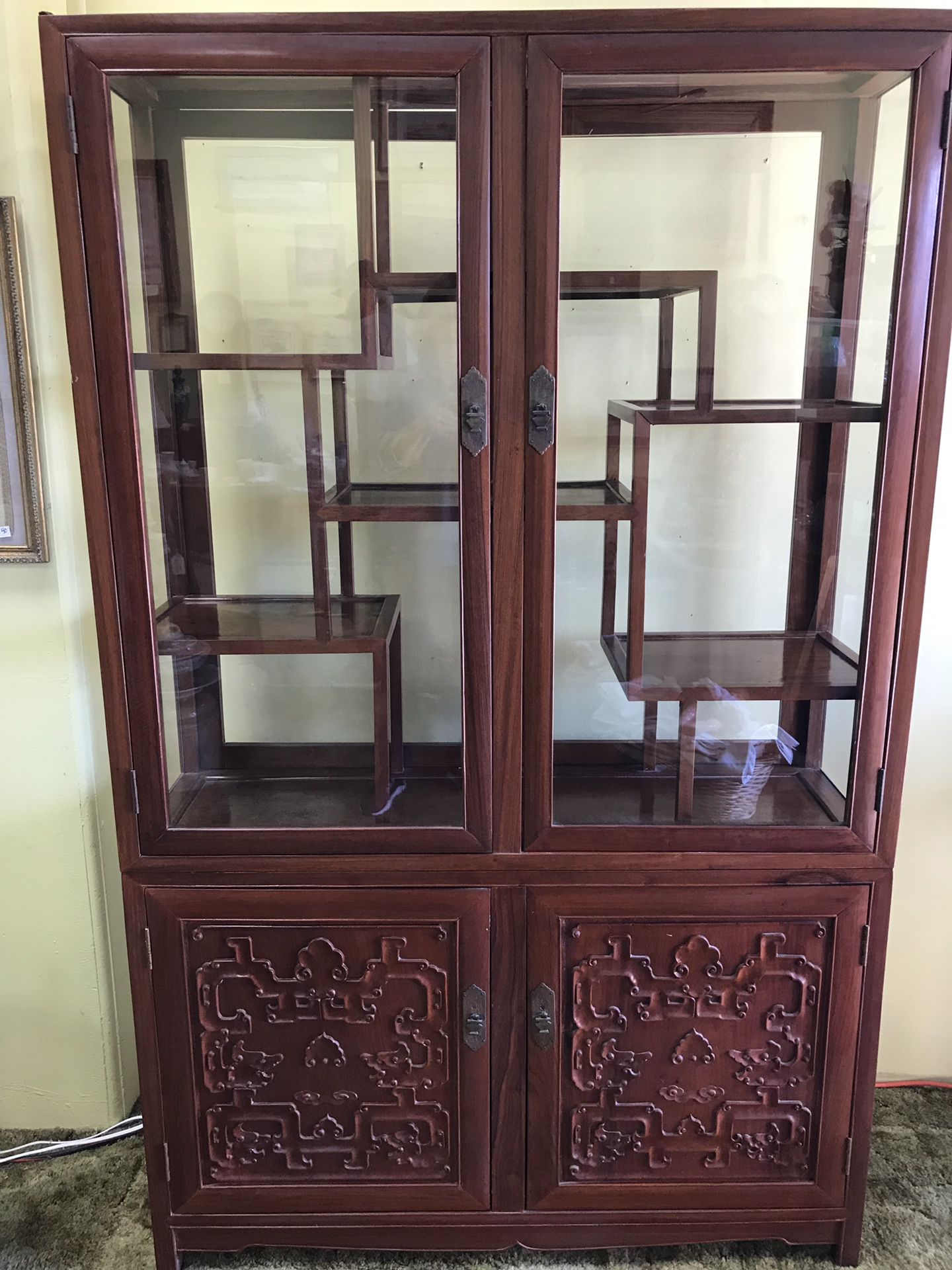 Vintage carved cherry wood Chinese cabinet.