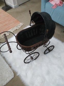 Antique doll carriage.
