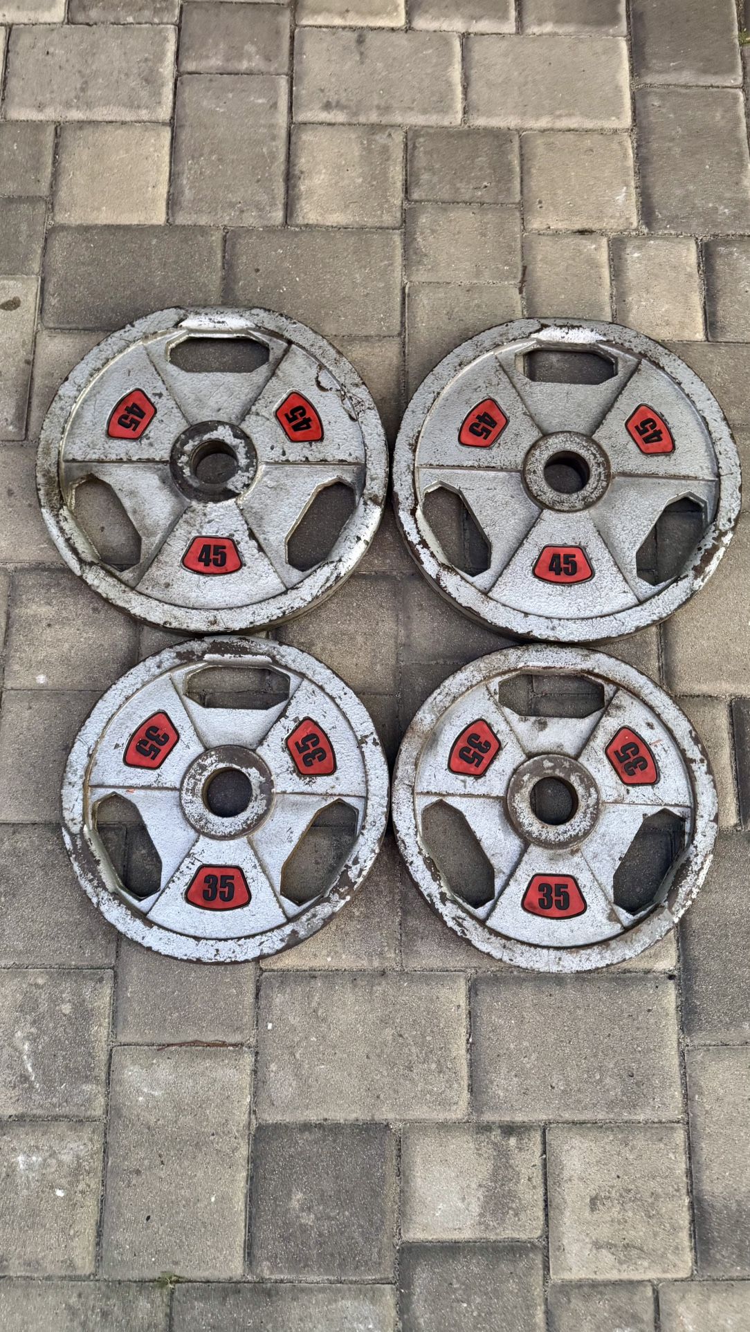 Pairs Of 35 And 45 Pound Olympic Weights