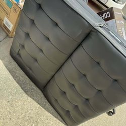 DHP Emily 71 Inch Futon Sofa Bed in Faux Leather, Armless Upholstered Couch Sleeper with Tufted Back and Seat, Mid-Century Modern, Black