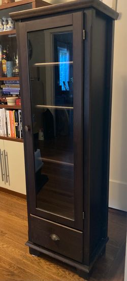 Dark brown glass door cabinet
