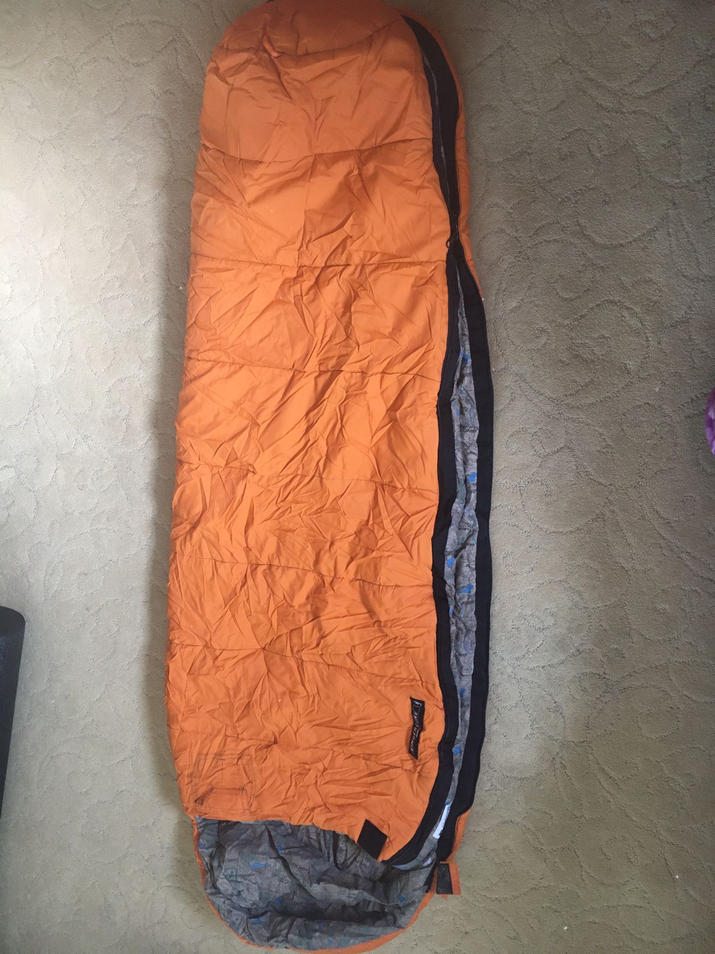 Kids REI Kindercone sleeping bag—orange