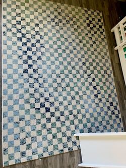 The blue, green, and cream checkerboard pattern distinctive and stylish