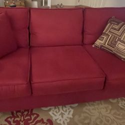 Red Couch With Decorative 4 Pillows 