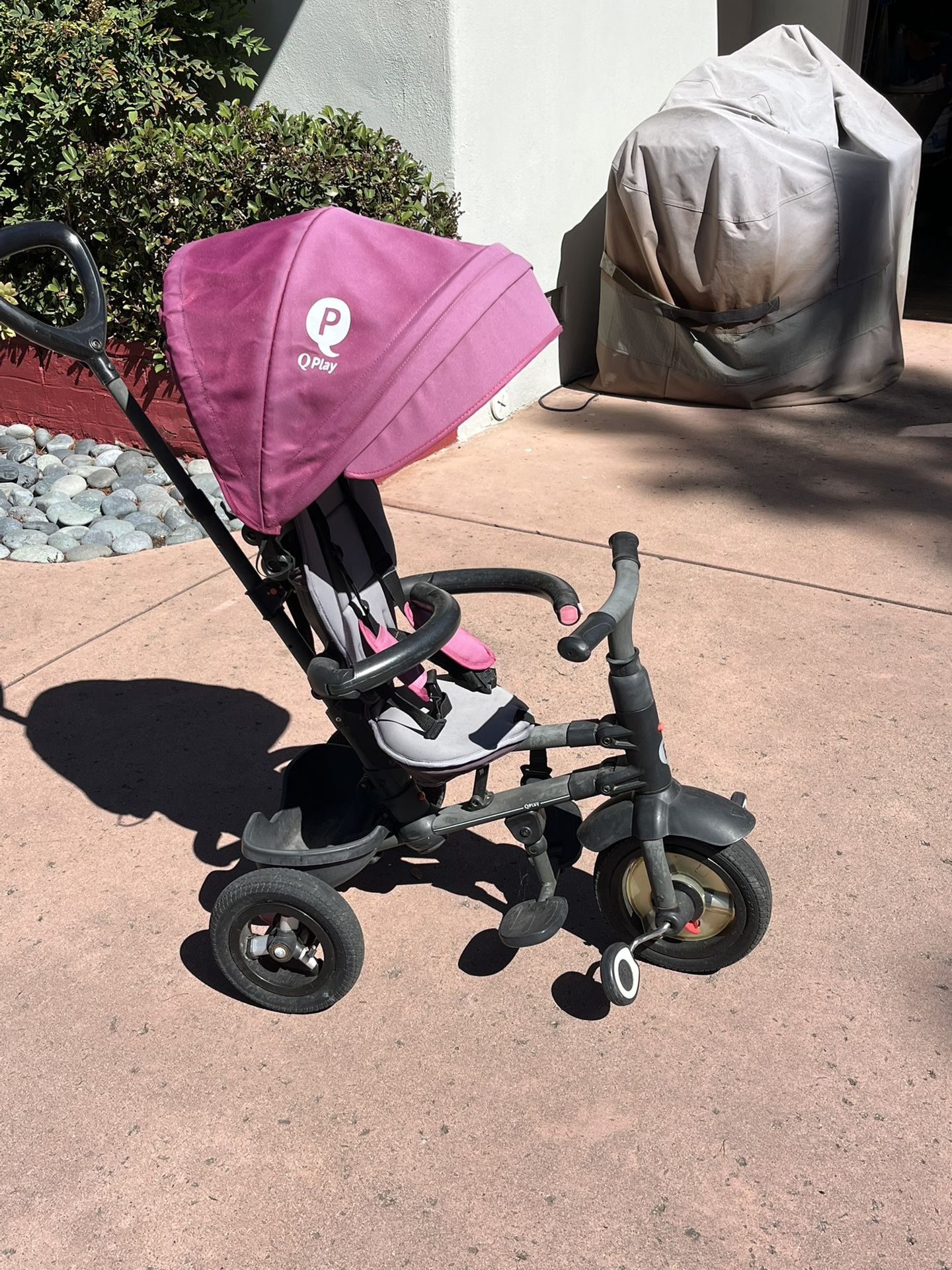 A Young Childs Trike And Stroller