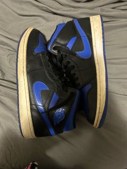 Black and blue Jordan 1s