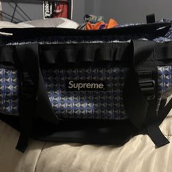 Supreme north face duffle bag