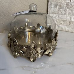 Metal and glass cake stand with dome