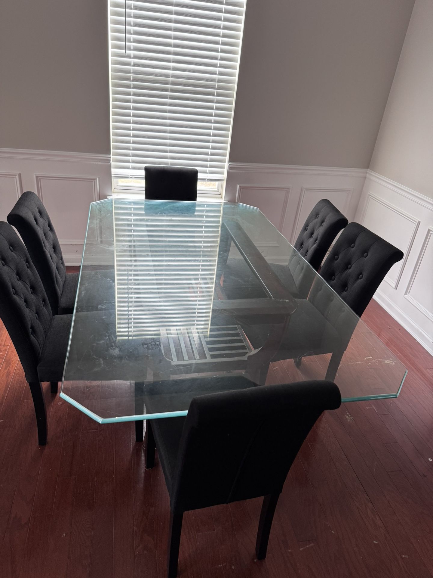 Glass dining room table with chairs