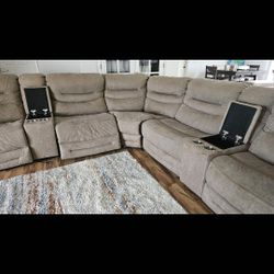 Large electronic Sectional With charging stations and storage.