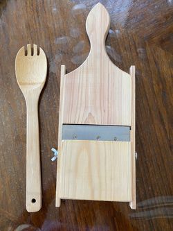 Wooden grater and a spoon.