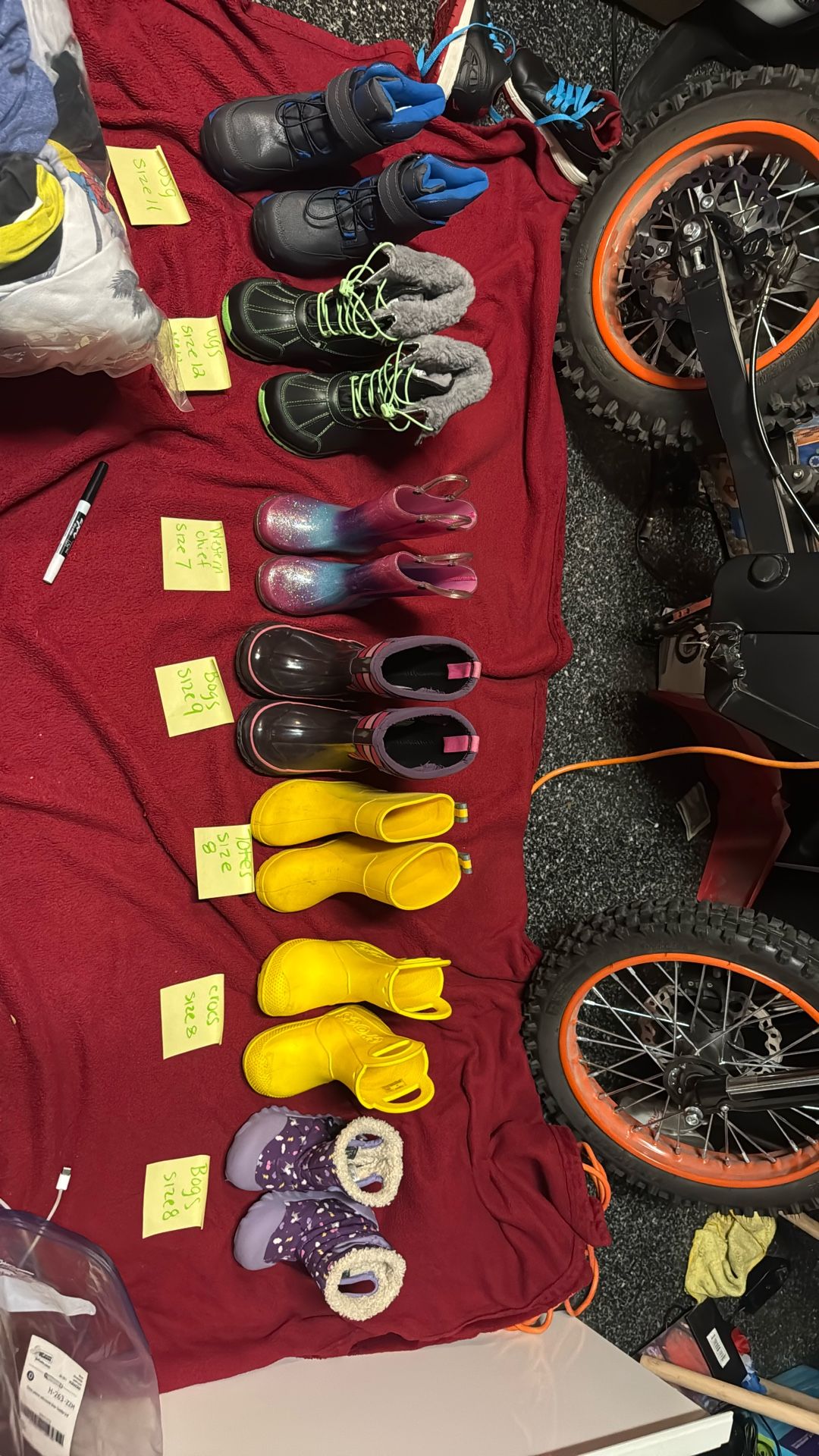 Various Size And Brands Of Boots