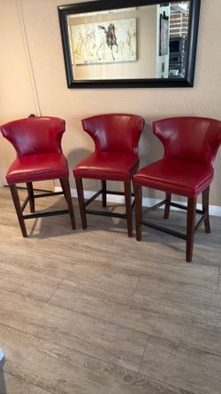 3 bar stools, red