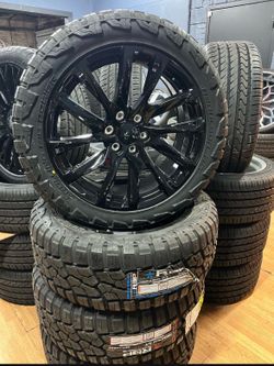 22 INCH BLACK RIMS AND TIRES DIRECT FIT NO LIFT NEEDED