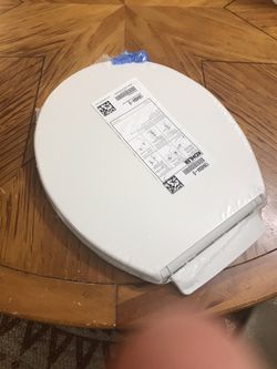 Kohler Toilet Cover.  Brand New, Never Used.  Still in  a rap. $30 or best offer!!