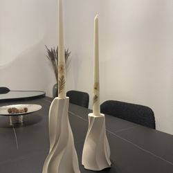two  white clay candle holder 