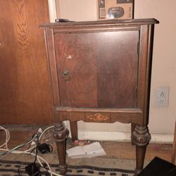 antique wooden smoking stand or humidor cabinet,