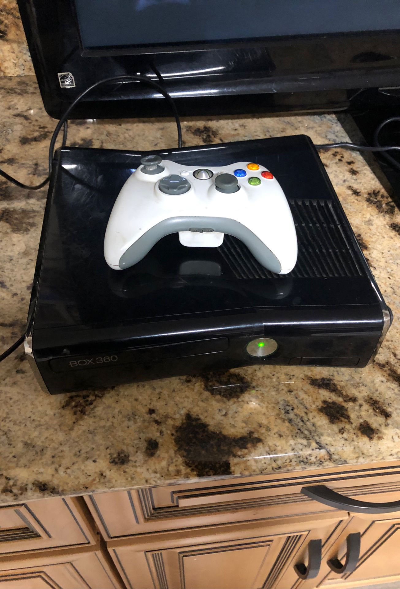 Xbox 360 with controller and a few games
