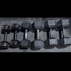 Assorted Dumbbells - Two 45’s, Three 25’s, One 30. 