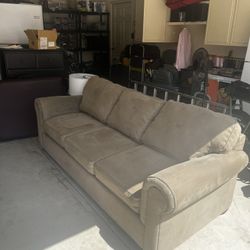 Beige Sofa With A Pull Out Bed