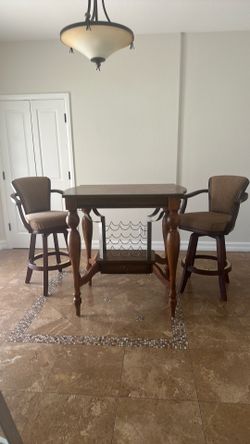Pub table with two barstools