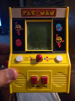 Hand held pac man arcade game