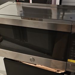 STAINLESS STEEL OVER THE COUNTER MICROWAVE....$ 50
