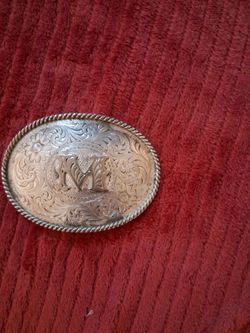 Sliversmith belt buckle.