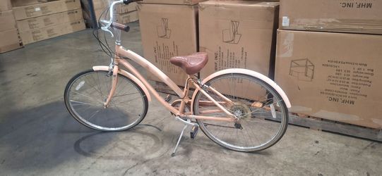Pink Cruiser Bicycle with Brown Saddle