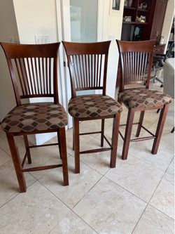 Dark wood upholstered bar stools