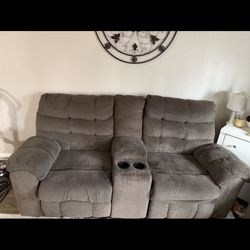 Grey love seats and dual recliners with center console 