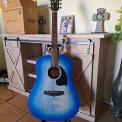 Ibanez blue sunburst acoustic guitar with stand