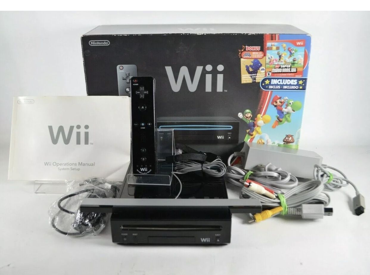 NINTENDO WII + 500 Games WII SPORTS, MARIO BROTHERS, MAEIO PARTY 8, JUST DANCE, DONKEY KONG and Many More